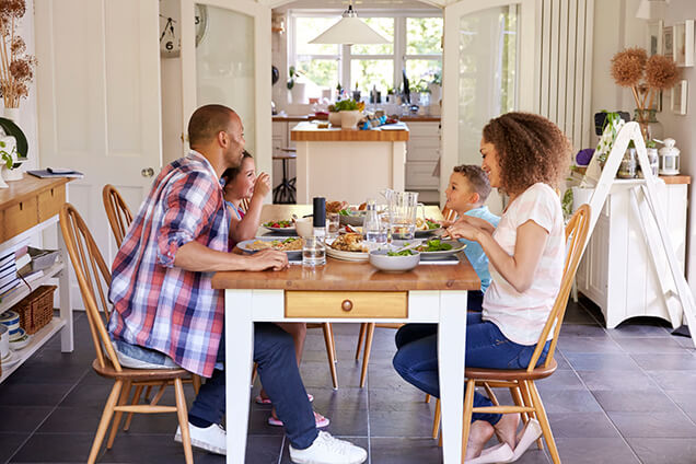 family eating dinner together with air conditioning