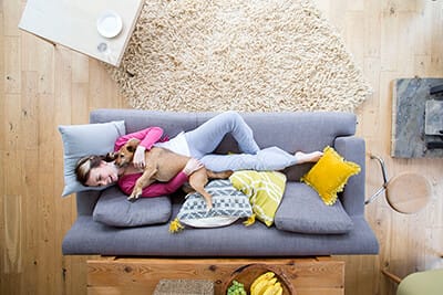 Woman enjoying indoor heating comfort